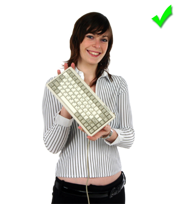 Picture - Holding the Cherry G84 compact keyboard.
