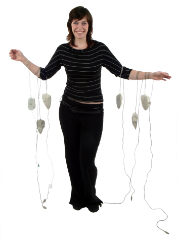 Picture - User with mice hanging from her arms.