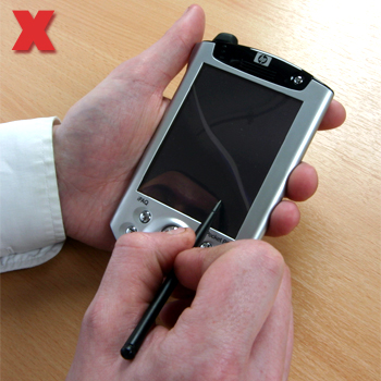 Picture - PDA, typing on an on screen keyboard.