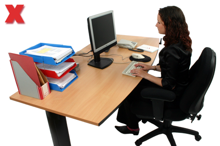 Picture - Leaning forward to see the screen can lead to muscular problems.